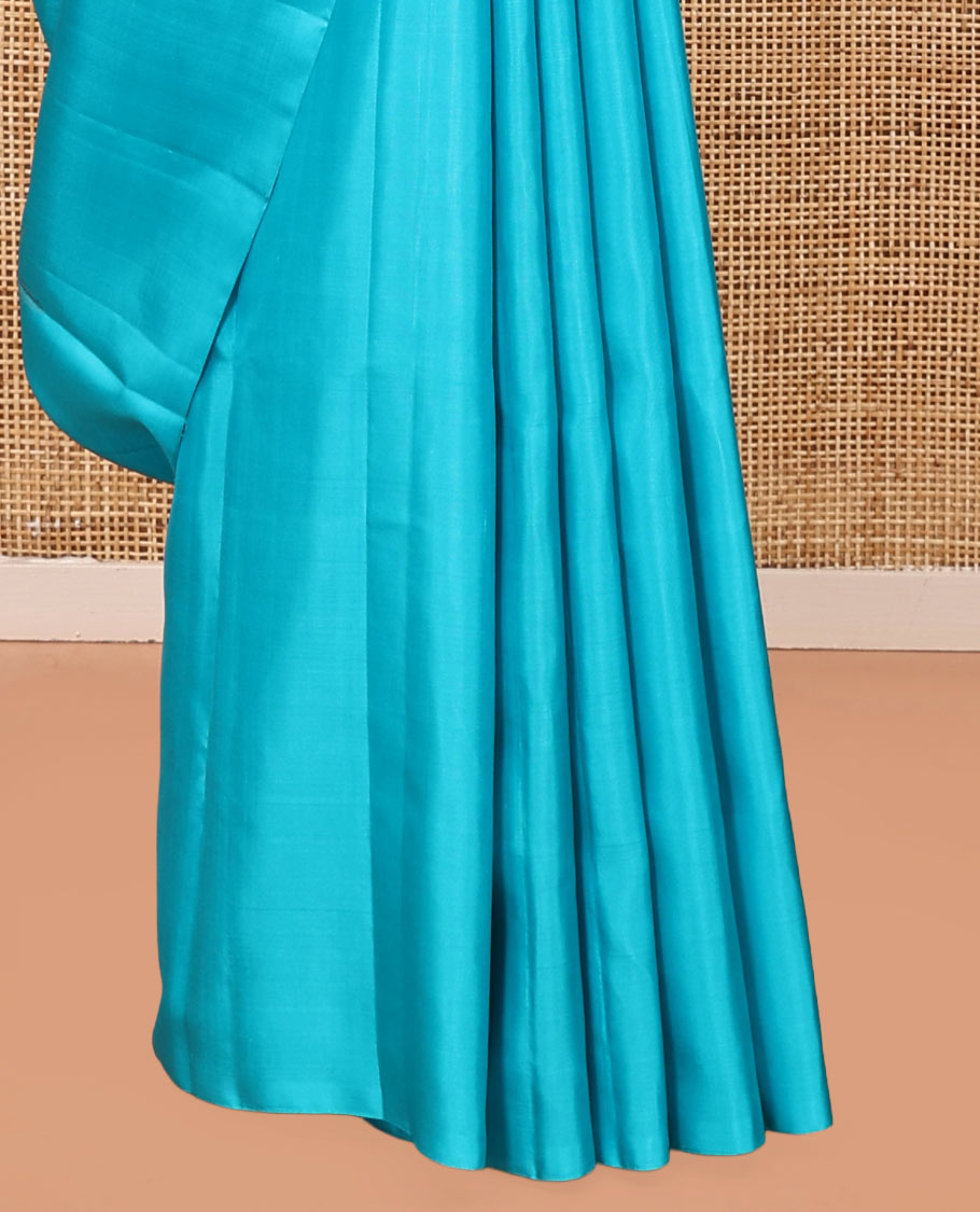 Borderless Blue Mayuri Soft Silk Saree, Sparsely Woven with Floral Buttas All Over Its Body, Sparsely Sparkled Pallu, and Paired with a Matching Blouse