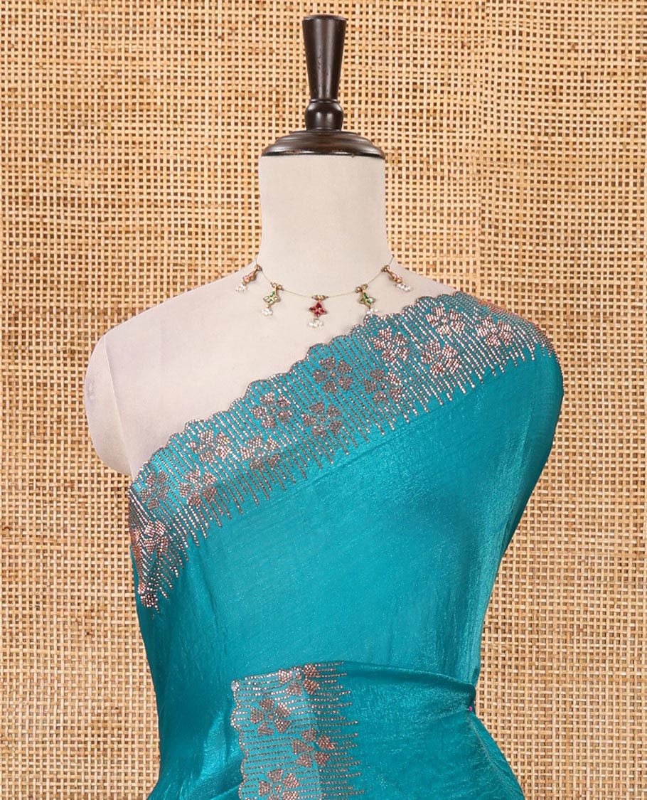 Peacock green full-plain Fendy satin saree, scallop floral micro-stone embroidered border, self-pallu & contrast stone work blouse