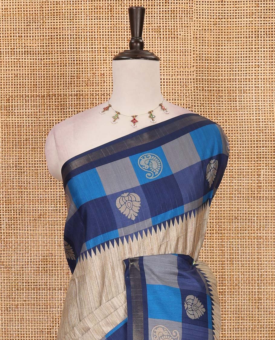 Chikku-blue plain kathan silk saree, contrast buttas enclosed multi-color checked blocks border, temple pallu, and contrast blouse of checks, and buttas