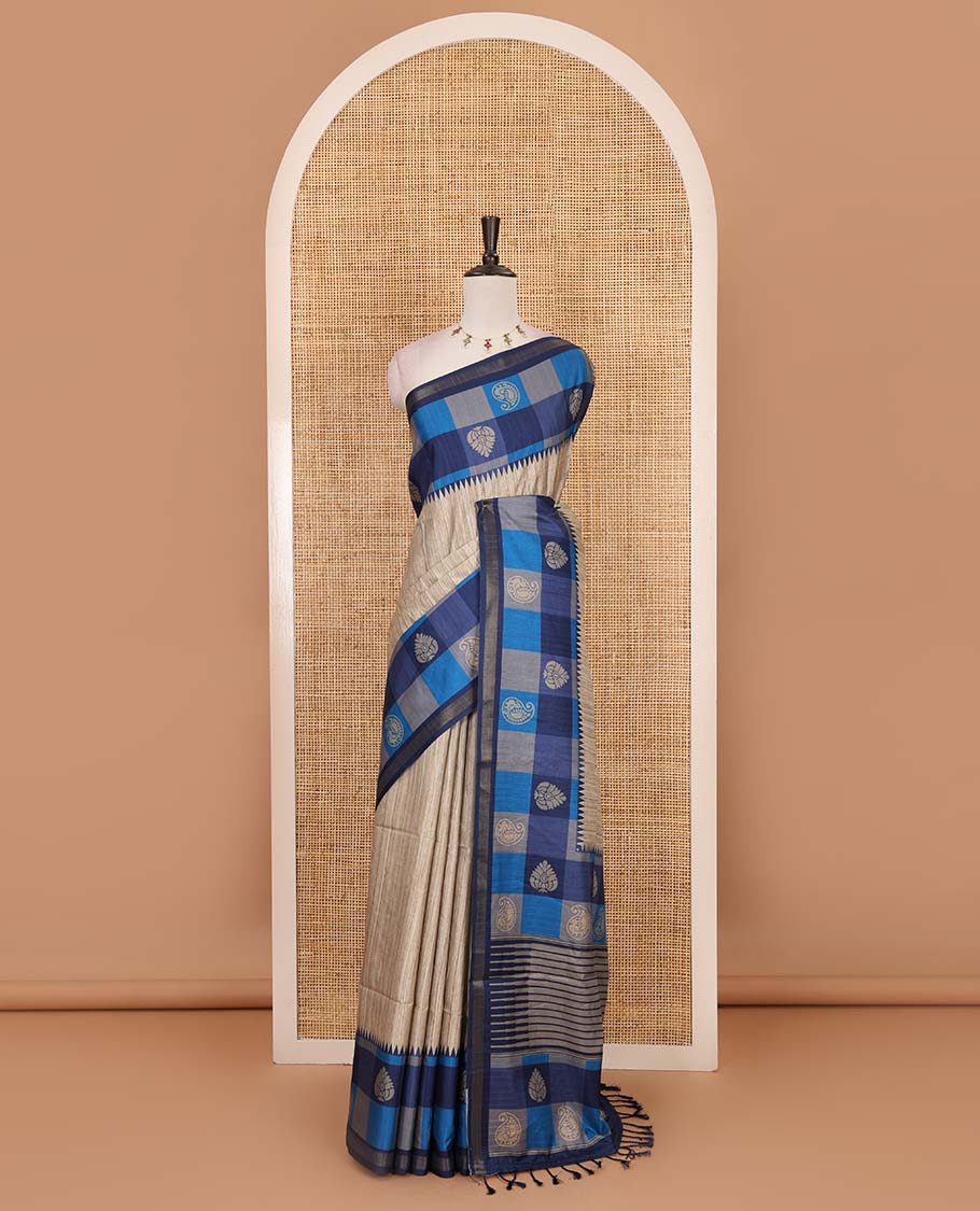 Chikku-blue plain kathan silk saree, contrast buttas enclosed multi-color checked blocks border, temple pallu, and contrast blouse of checks, and buttas