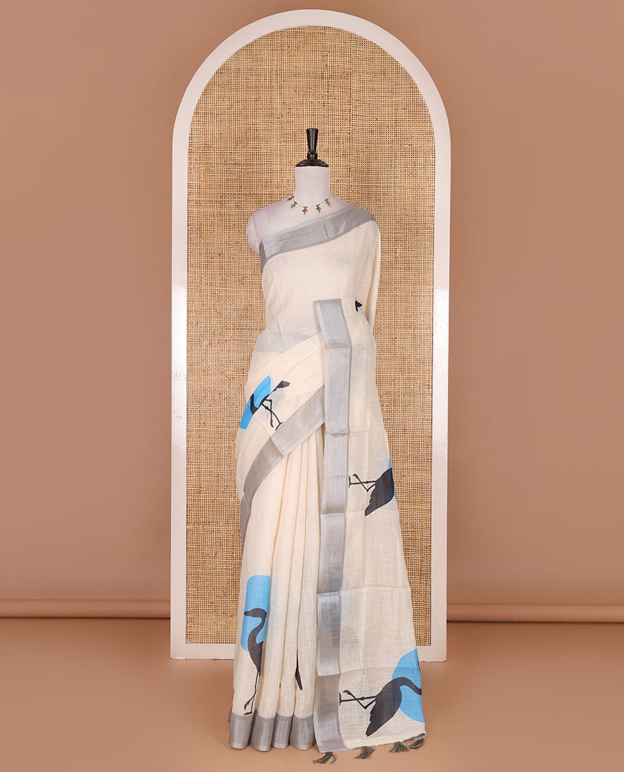 Cream hand painting style deer motifs printed linen cotton saree, silver bavanji border, and vertical stripes printed blouse