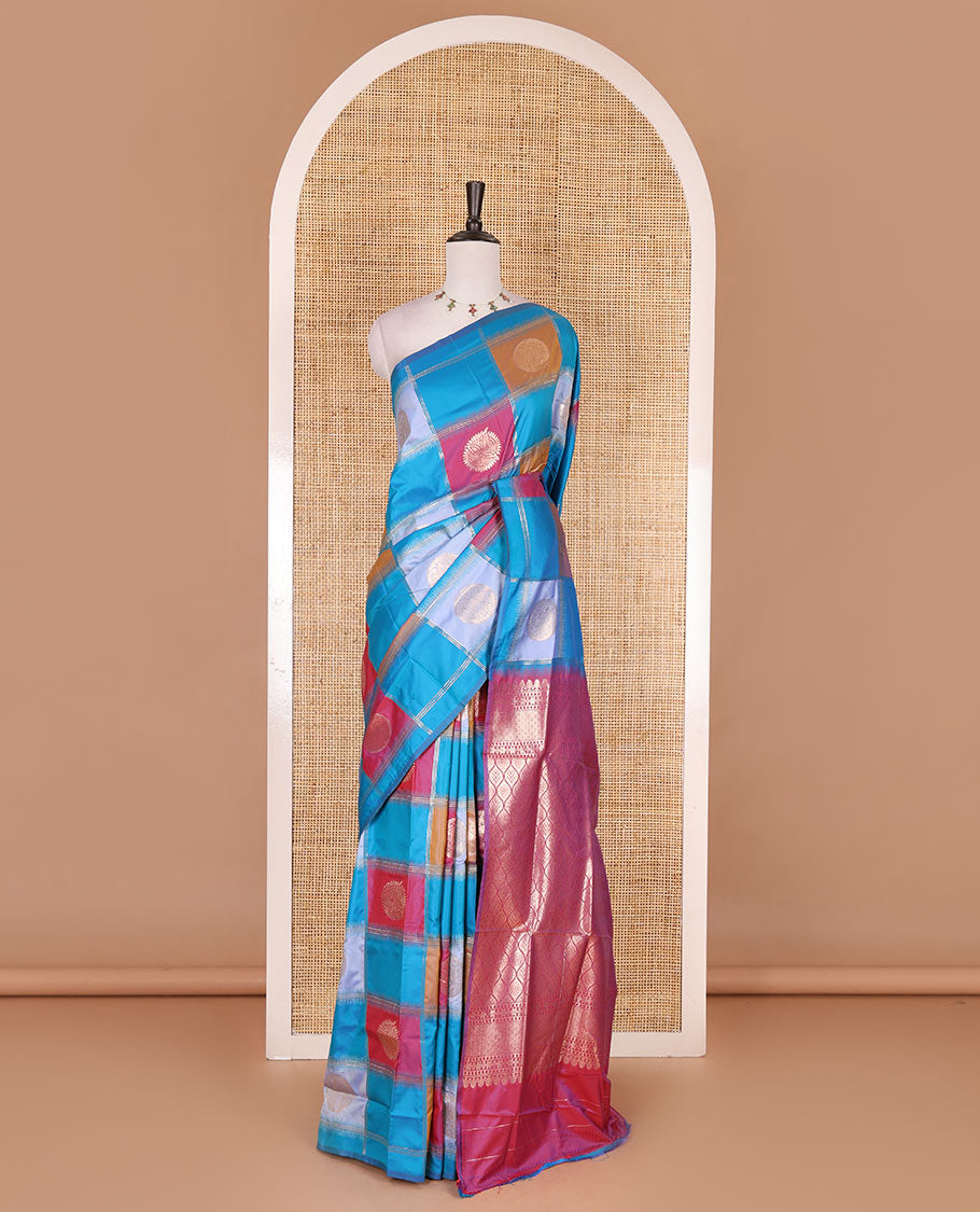 Borderless blue chakra buttas enclosed, checked elite soft silk saree, contrast ogee patterned pallu, and contrast zari design blouse