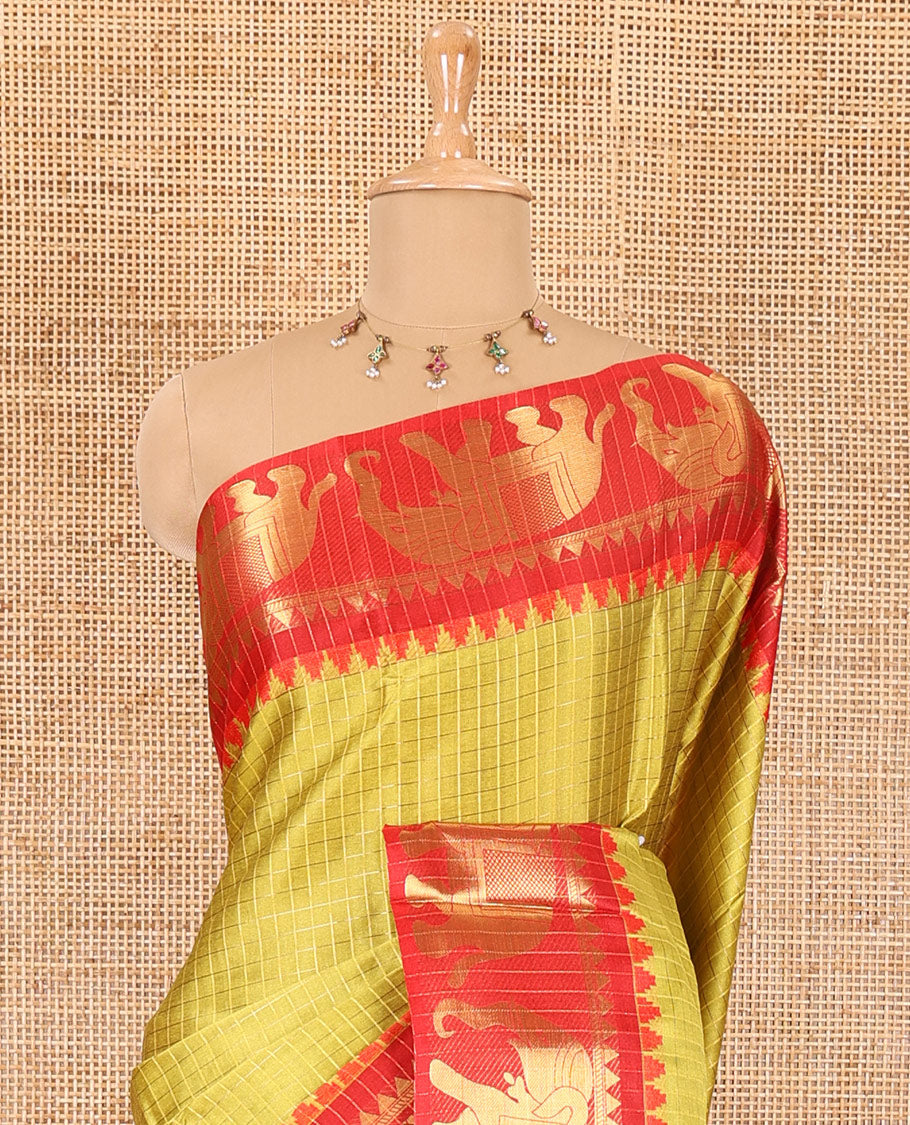 Yellow zari checked semi-taffeta saree, contrast satin temple border of elephant motifs, striped pallu, and a contrast striped blouse