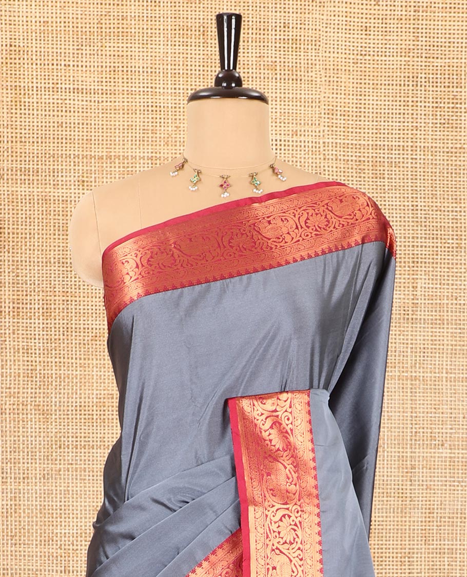 Grey plain luxury soft silk saree, contrast traditional temple zari border of elephant motifs, geometric zari pallu, and a contrast jacquard blouse