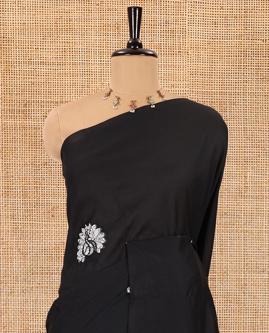 Borderless black peacock motifs patch embroidered South cotton saree with a plain blouse and a contrast paisleys printed blouse