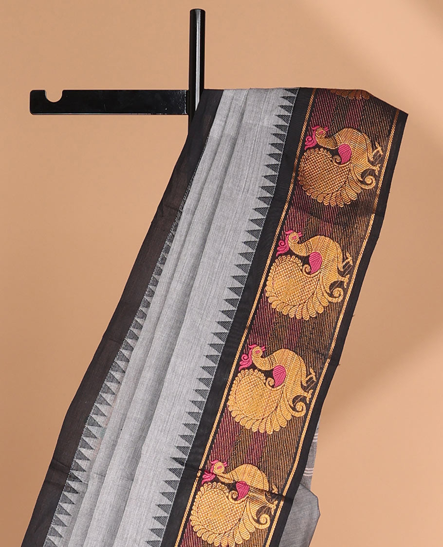 Grey chettinad cotton saree with temple, peacock design border & pathik print blouse