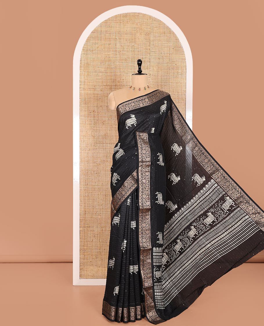 Black Dola Silk Saree Featuring Sequin Stripes and Pichwai Cow Motifs, Decorated with a Floral Creeper Zari-Woven Border, a Printed Pallu, Paired with a Matching Blouse