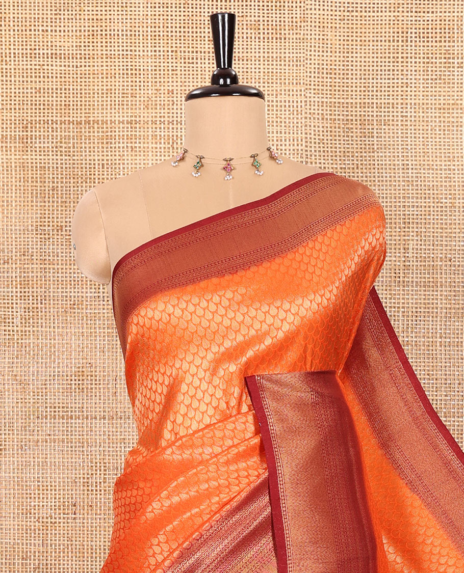Rust Orange Luxury Soft Silk Saree Featuring Drop-Shaped Zari Motifs Steeped All Over Its Body, Highlighted with a Contrast Traditional Zari Border, Pallu Decked Up with Intricate Designs, and Paired with a Contrast Jacquard Blouse