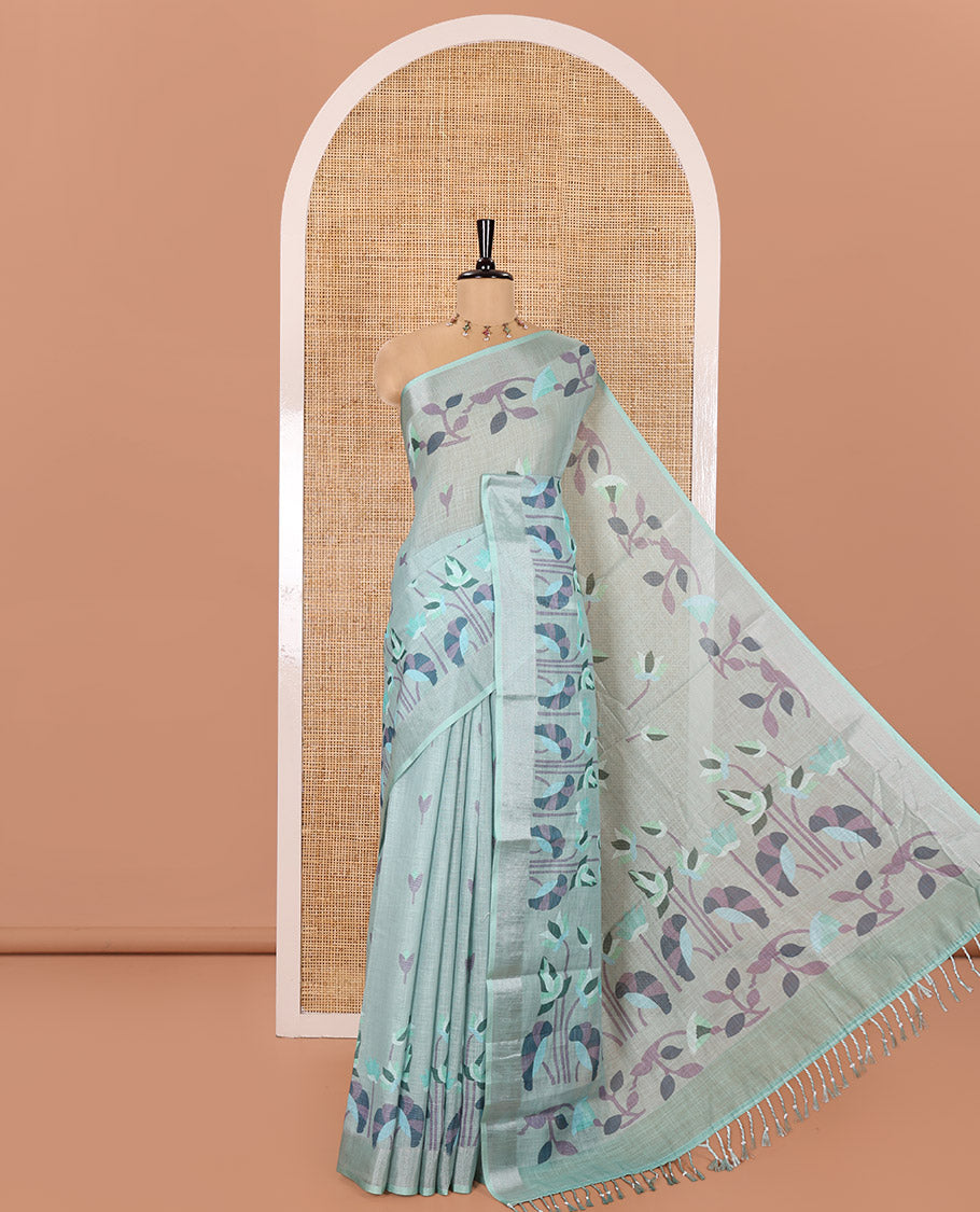 Sea Green Linen Cotton Saree, Accentuated with Jamdani-Style Lotus Designs Printed All Over Its Body, Zari Tissue Border, Pallu Mirrors the Same Print, and Paired with a Matching Blouse