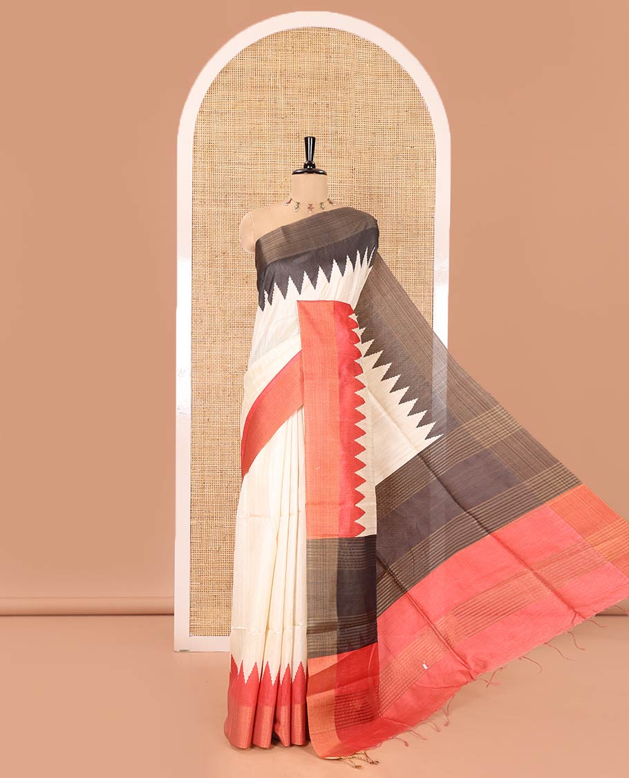 Cream Plain Semi-Jute Tussar Saree, Complemented by a Contrast Blue-Red Ganga-Jamuna Temple Border, Sparsely Striped Pallu, and Paired with a Contrast Blouse