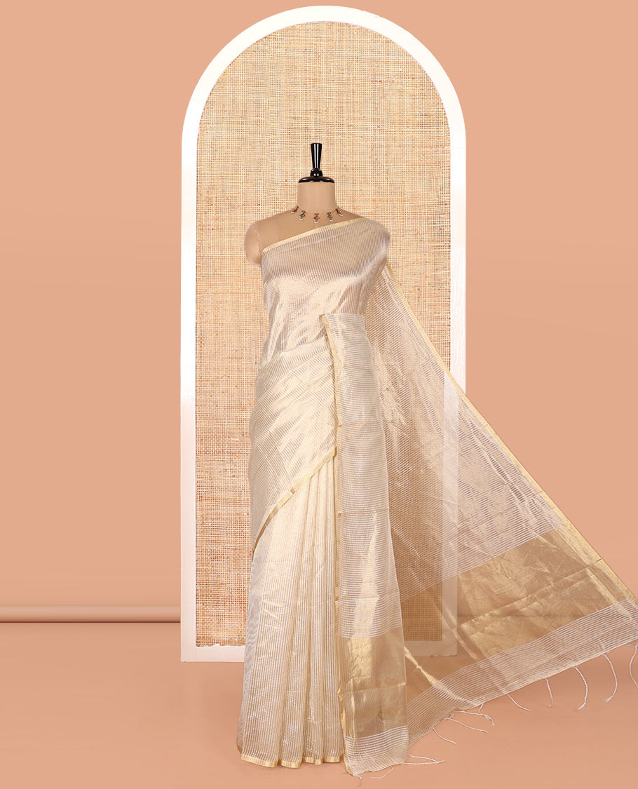 Borderless Off-white Tissue Saree, Steeped with Thin Vertical Zari Stripes All Over Its Body, Highlighted by Gleaming Zari Striped Pallu, and Paired with a Matching Blouse