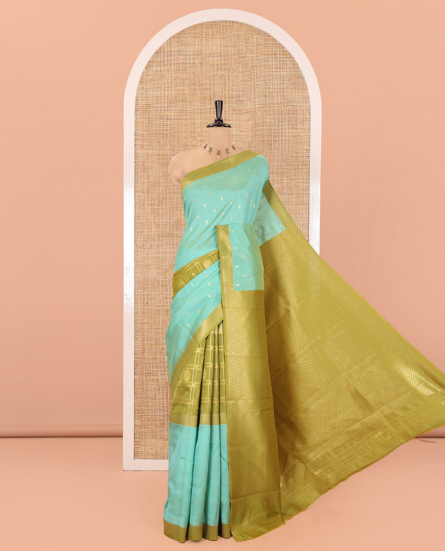 Sea Green and Mehendi Kanchi Silk Saree, Subtly Enriched with Zari Buttas and Buttas Enclosed Checks On Its Body, Complemented by Zari Border, Jaal Pallu, and Paired with a Contrast Jacquard Blouse