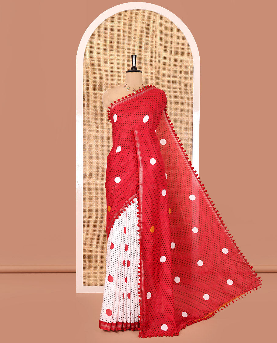 Red Chanderi Cotton Saree, Steeped with Small and Big Polka Dots on Its Body, Subtle Pom-Pom Tasseled Border, a Self-Pallu, and Paired with a Contrast Blouse