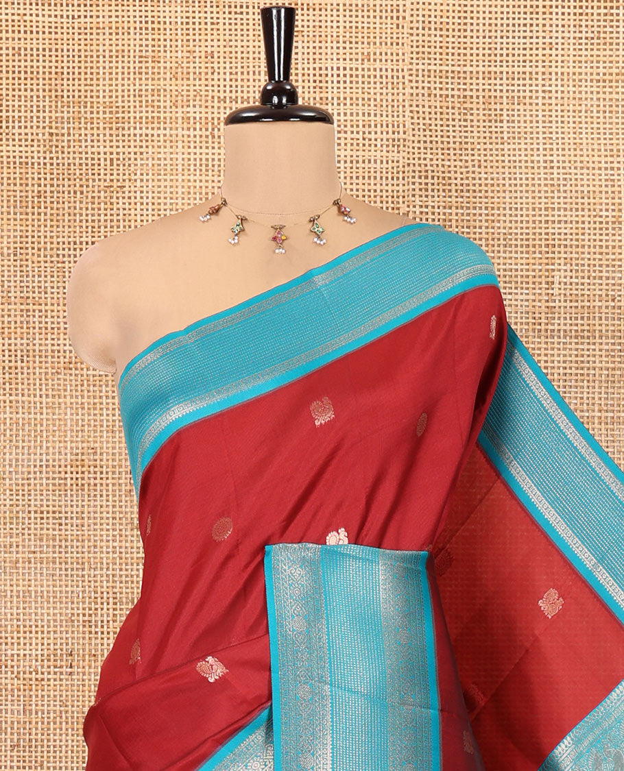 Maroon Kanchi Silk Saree Features Mayil-Chakram Buttas, a Contrast Traditional Border, Jaal Pallu, and a Contrast Blouse
