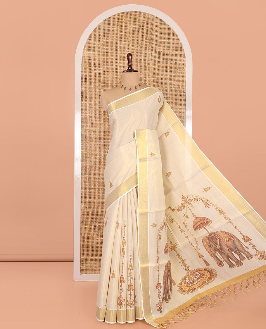 Gold Kerala Cotton Saree, Graced with Bell Motif Print, a Zari Border, Pallu of Elephant Motifs, and a Contrast Blouse