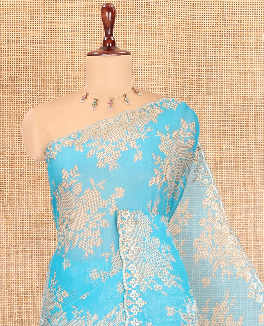 Blue Chiffon Saree Features Abstract Print, a Scallop Sequins Work Border, and Contrast Blouse