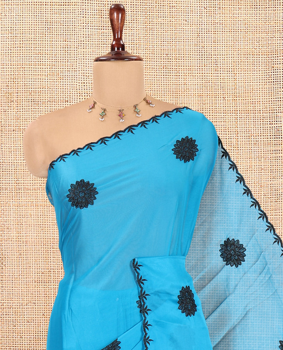 Blue Chiffon Saree, Gracefully Embellished with Floral Embroidery Buttas, a Lace Embroidered Border, a Contrast Blouse