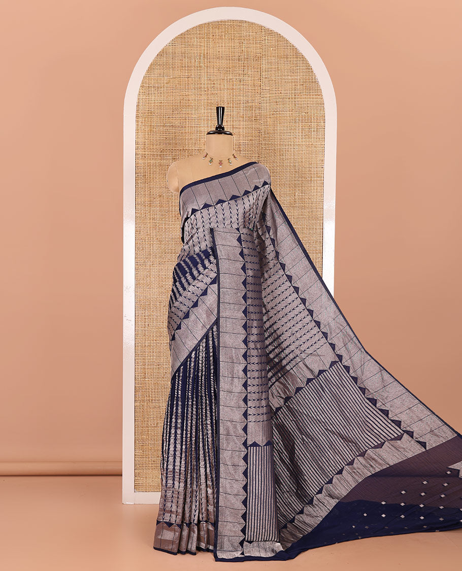 Navy blue zari geometric fancy crepe saree, temple zari border, zari striped pallu, and a matching buttas woven blouse