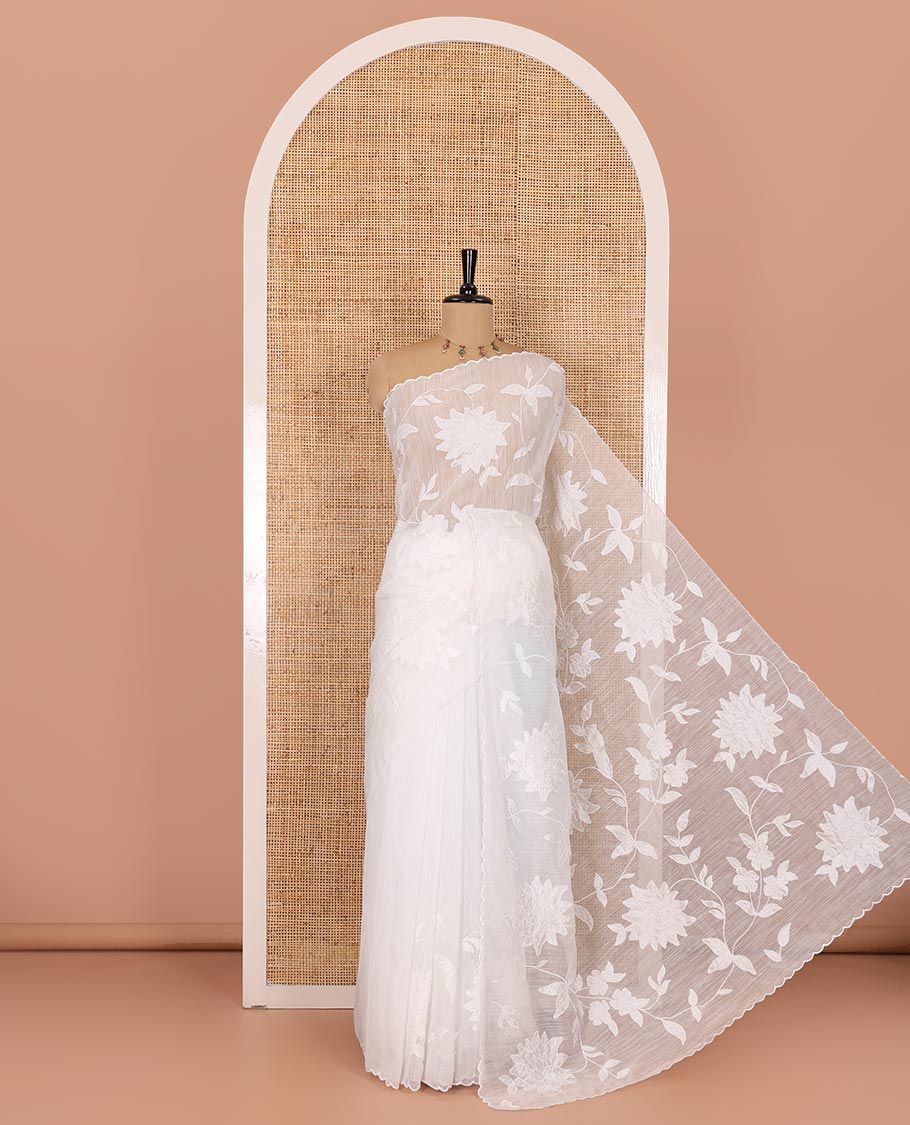 White floral vine applique embroidered linen saree, scallop border, floral motifs embroidered pallu, and a plain blouse