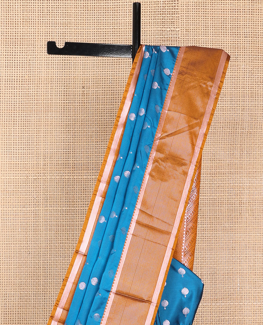 Blue semi-soft silk saree with zari buttas, contrast traditional zari design border & pallu of geometric designs