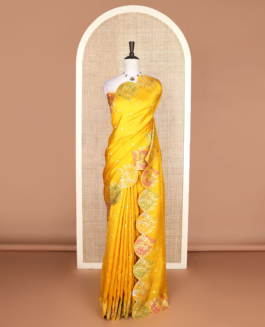 Bright yellow Matka silk saree features rudraksham motifs, scallop floral motifs and bird embossed thread embroidery border