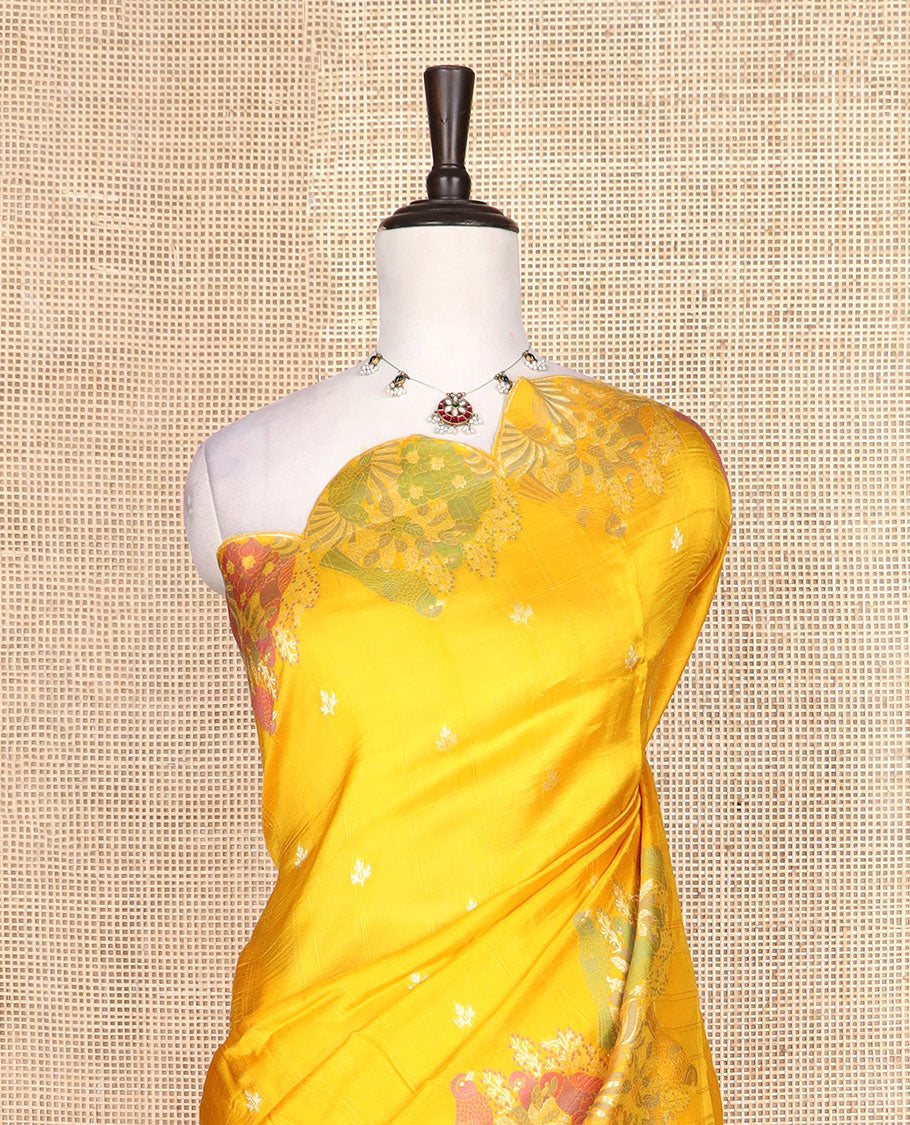 Bright yellow Matka silk saree features rudraksham motifs, scallop floral motifs and bird embossed thread embroidery border