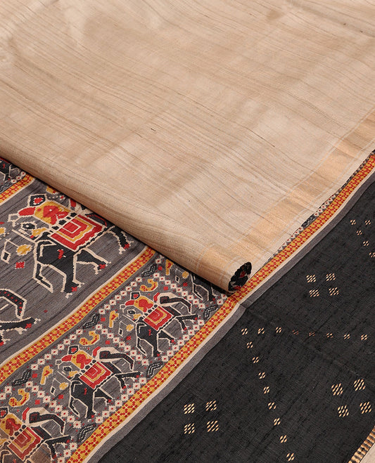 Sandal plain design tussar saree, zari border & contrast pallu adorned with patola-style elephant motifs print