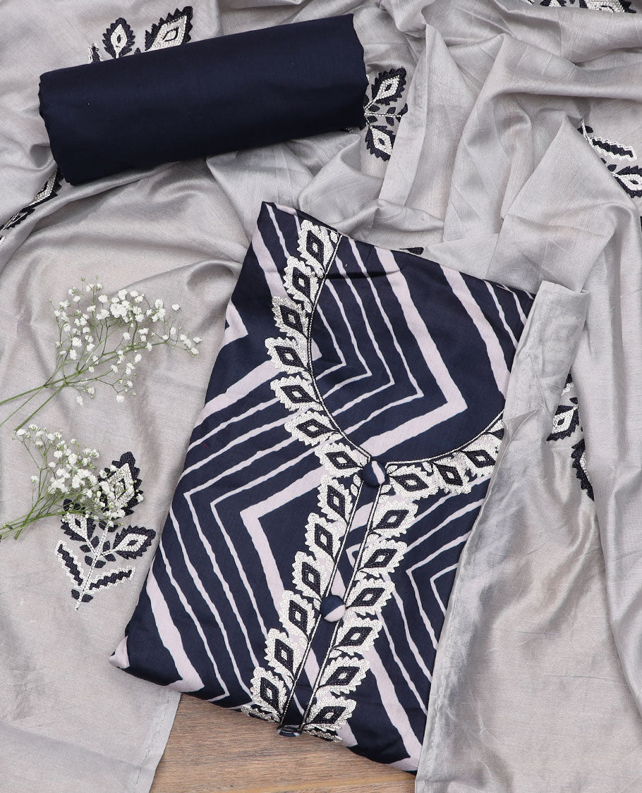 Blue material churidar set, chevron printed and embroidered top, plain bottom, and a embroidered motifs dupatta