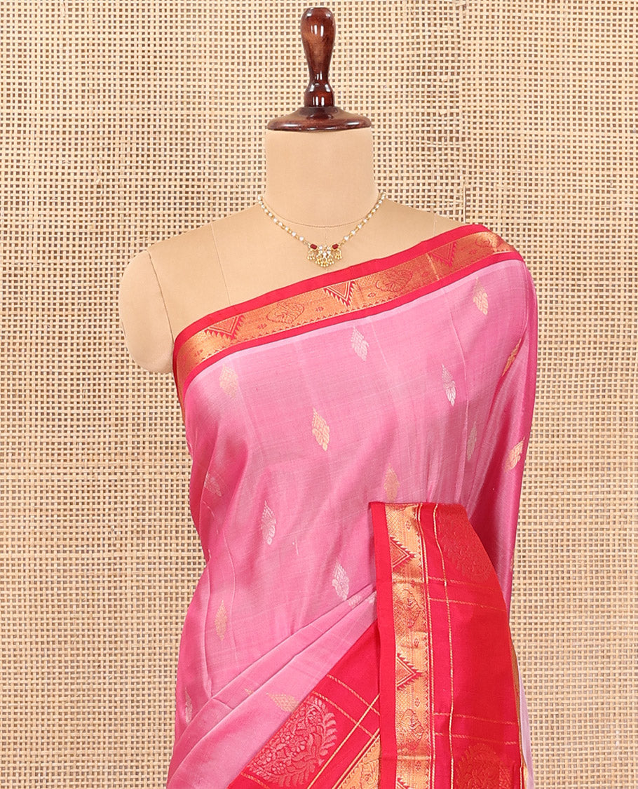 Pink Uppada Silk Saree Detailed with Zari Buttas All Over Its Body, Complemented by a Contrast Border of Traditional Zari Designs, Sparsely Sparkled Pallu of Floral-Paisley Designs, and Paired with a Contrast Blouse