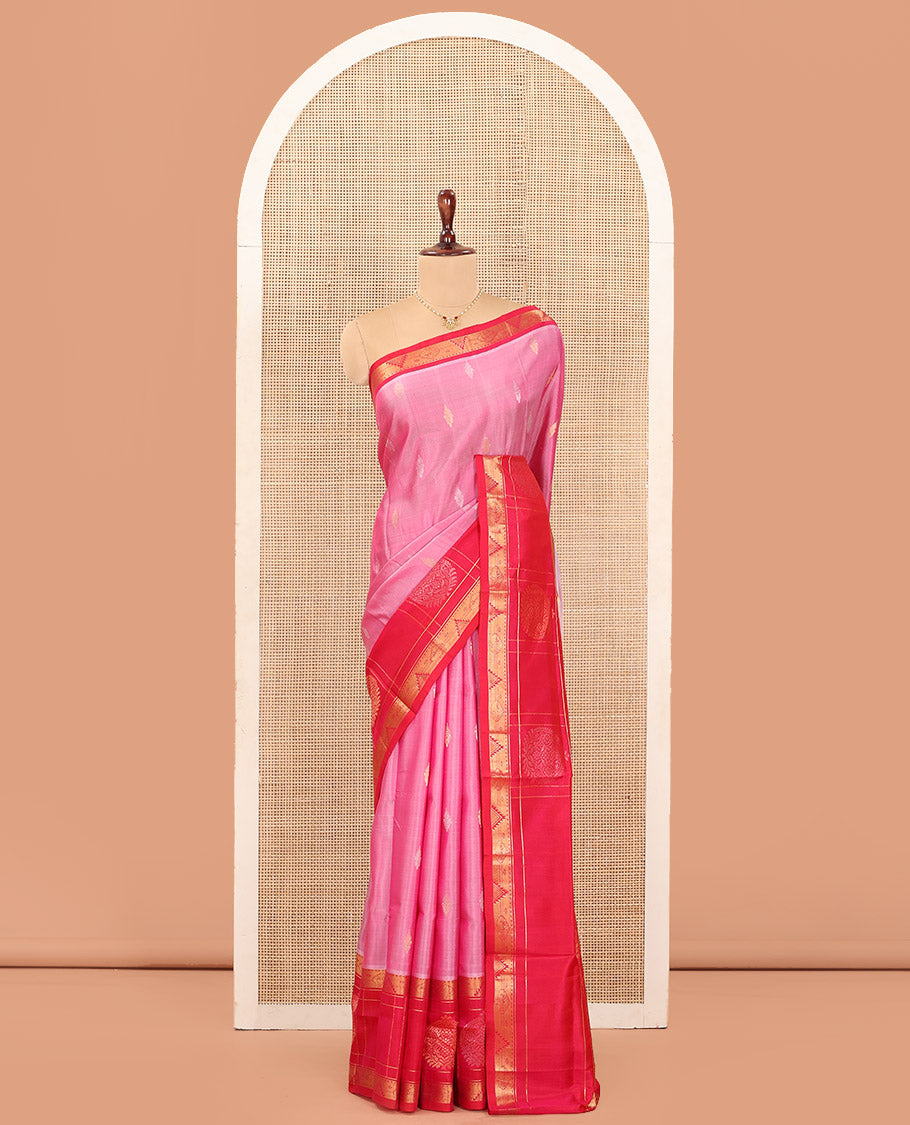 Pink Uppada Silk Saree Detailed with Zari Buttas All Over Its Body, Complemented by a Contrast Border of Traditional Zari Designs, Sparsely Sparkled Pallu of Floral-Paisley Designs, and Paired with a Contrast Blouse