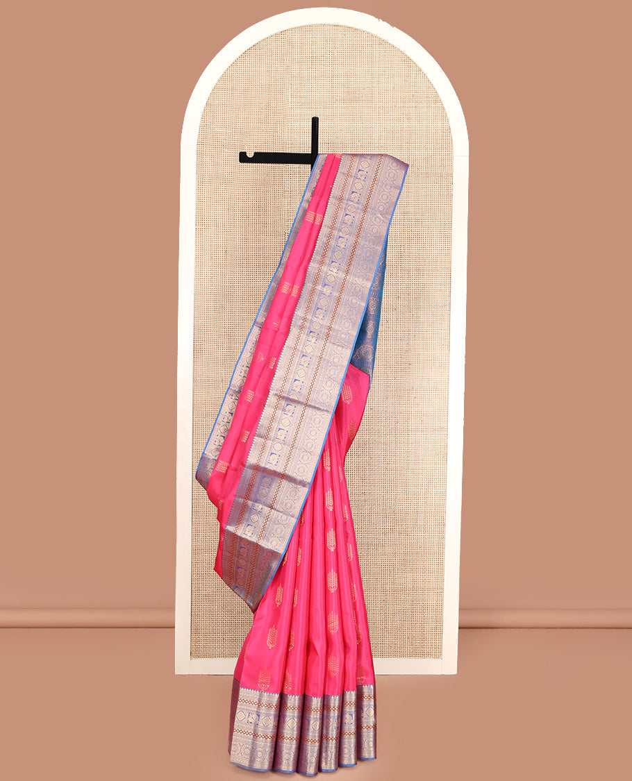 Pink Vasundhara Lite Silk Mix Saree, Beautified with Deepam Buttas, Complemented by a Contrast Border of Thilakam Mokku, Poun, Muthu, Diamond and Chakram Designs, Pallu Steeped with Chakram Designs, and Paired with a Contrast Blouse