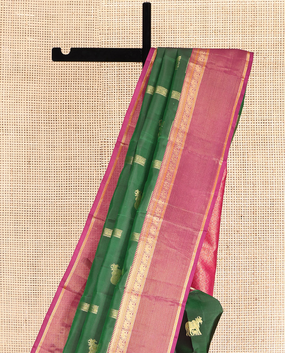 Green Vasundhara Lite Silk Mix Saree, Adorned with Pichwai Cow Buttas, Complemented by a Contrast Border of Rekku, Neli, and Yaanai Designs, Intricate Pallu, and a Contrast Blouse