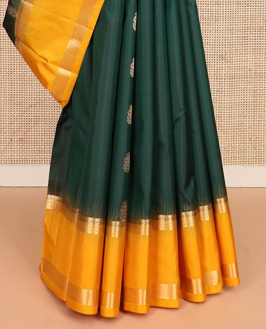 Green zari buttas silk saree, contrast rettai pettu border of rekku, muthu, and diamond designs, and jaal pallu