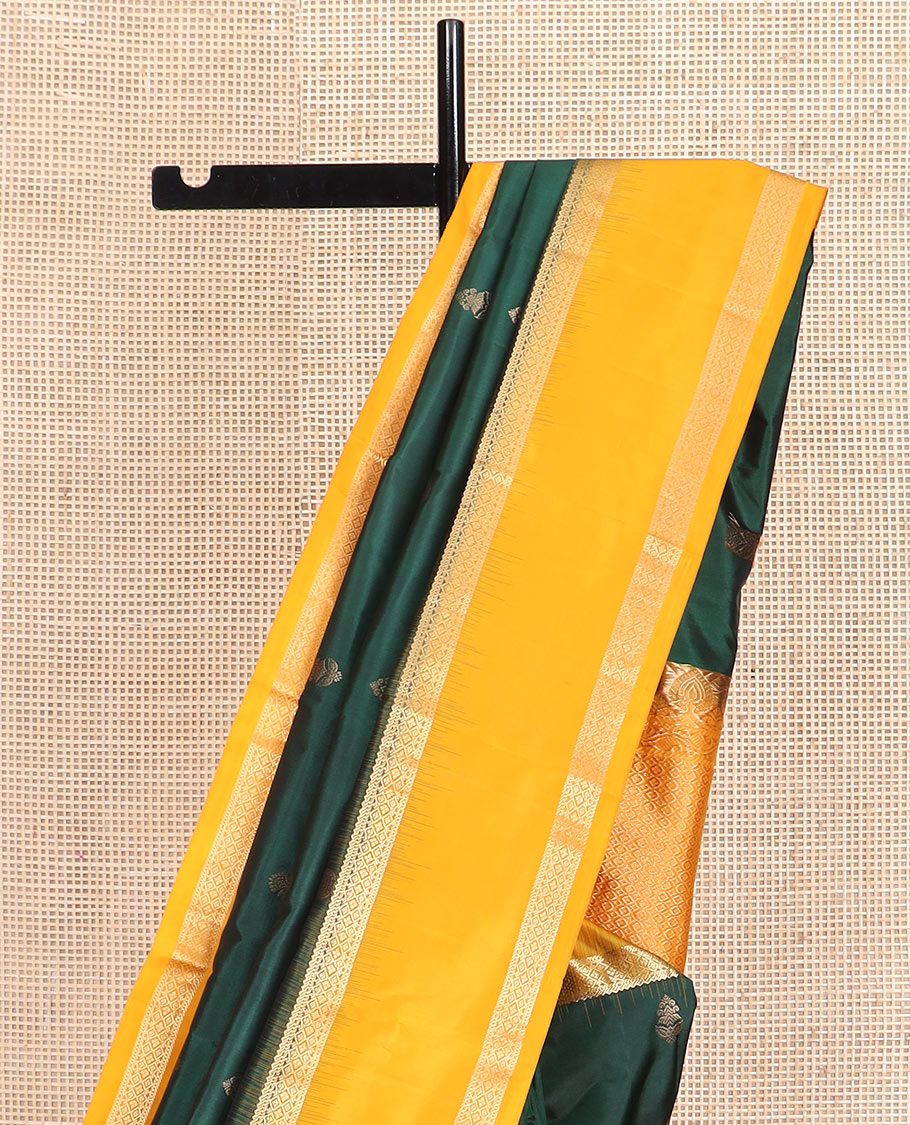 Green zari buttas silk saree, contrast rettai pettu border of rekku, muthu, and diamond designs, and jaal pallu