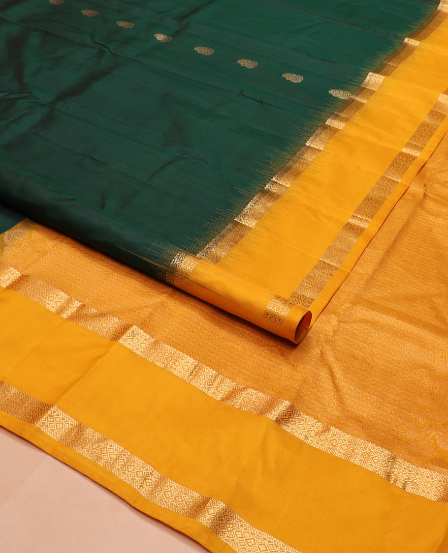 Green zari buttas silk saree, contrast rettai pettu border of rekku, muthu, and diamond designs, and jaal pallu