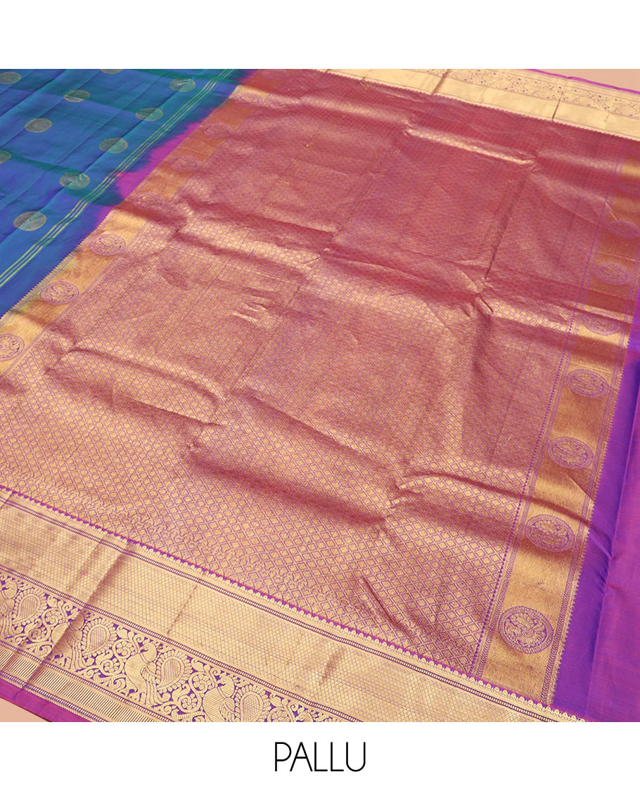 Blue Vasundhara Silk Saree Richly Detailed with Round Mayil Buttas, Highlighted with a Contrast Border of Muthu, Mayil Kann, and Mayil Designs, Grandly Zari Woven Pallu of Jaal Design, and Paired with a Contrast Blouse
