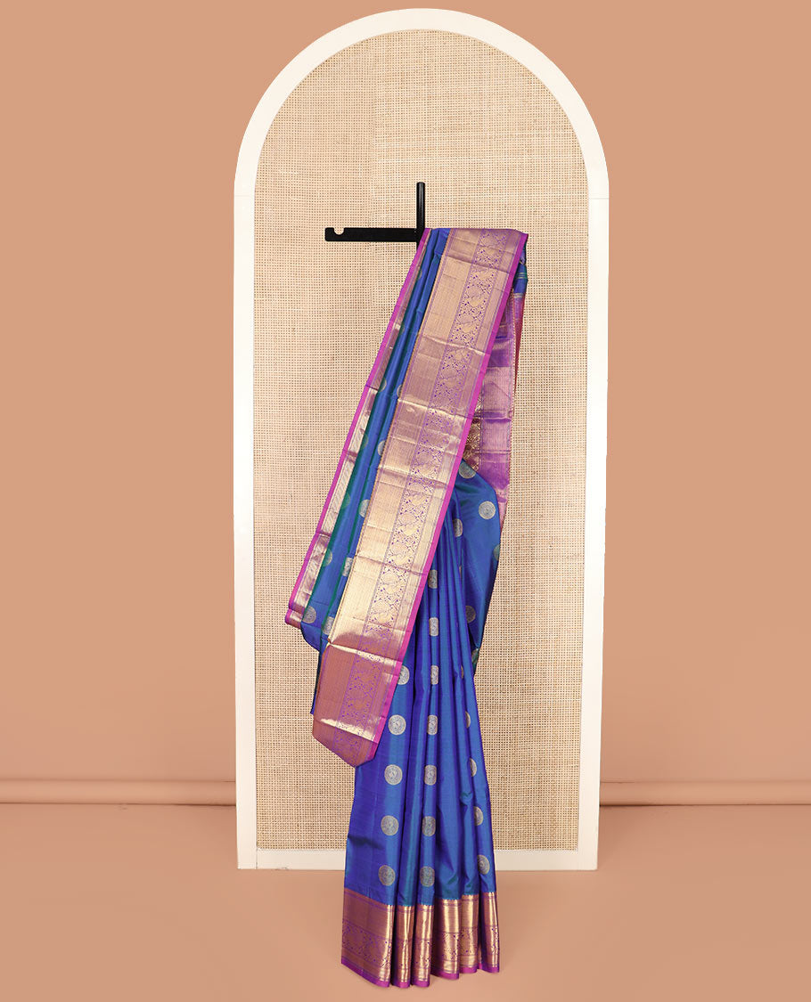 Blue Vasundhara Silk Saree Richly Detailed with Round Mayil Buttas, Highlighted with a Contrast Border of Muthu, Mayil Kann, and Mayil Designs, Grandly Zari Woven Pallu of Jaal Design, and Paired with a Contrast Blouse