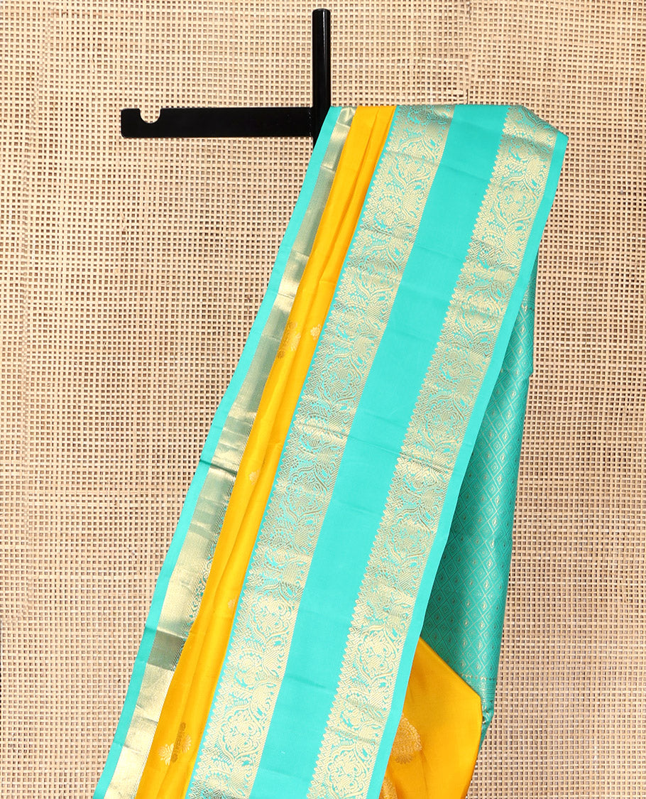 Yellow Vasundhara Silk Saree, Woven with Zari Buttas, Complemented by a Contrast Rettai Pettu Mayil-Yaanai Border, Jaal Pallu, and a Contrast Blouse