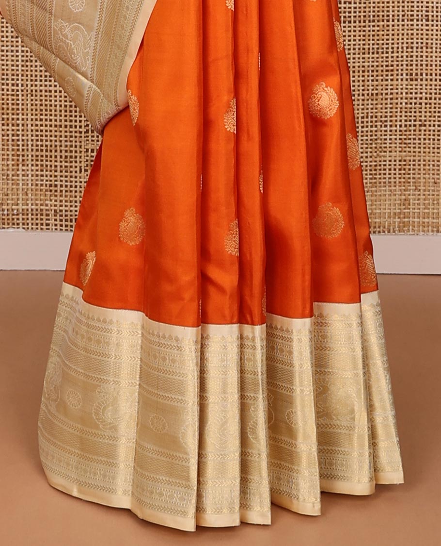Orange zari buttas silk saree, contrast mayil kann pallu & border of thilakam,kathir,rudraksham,mayil kann & annam chakram