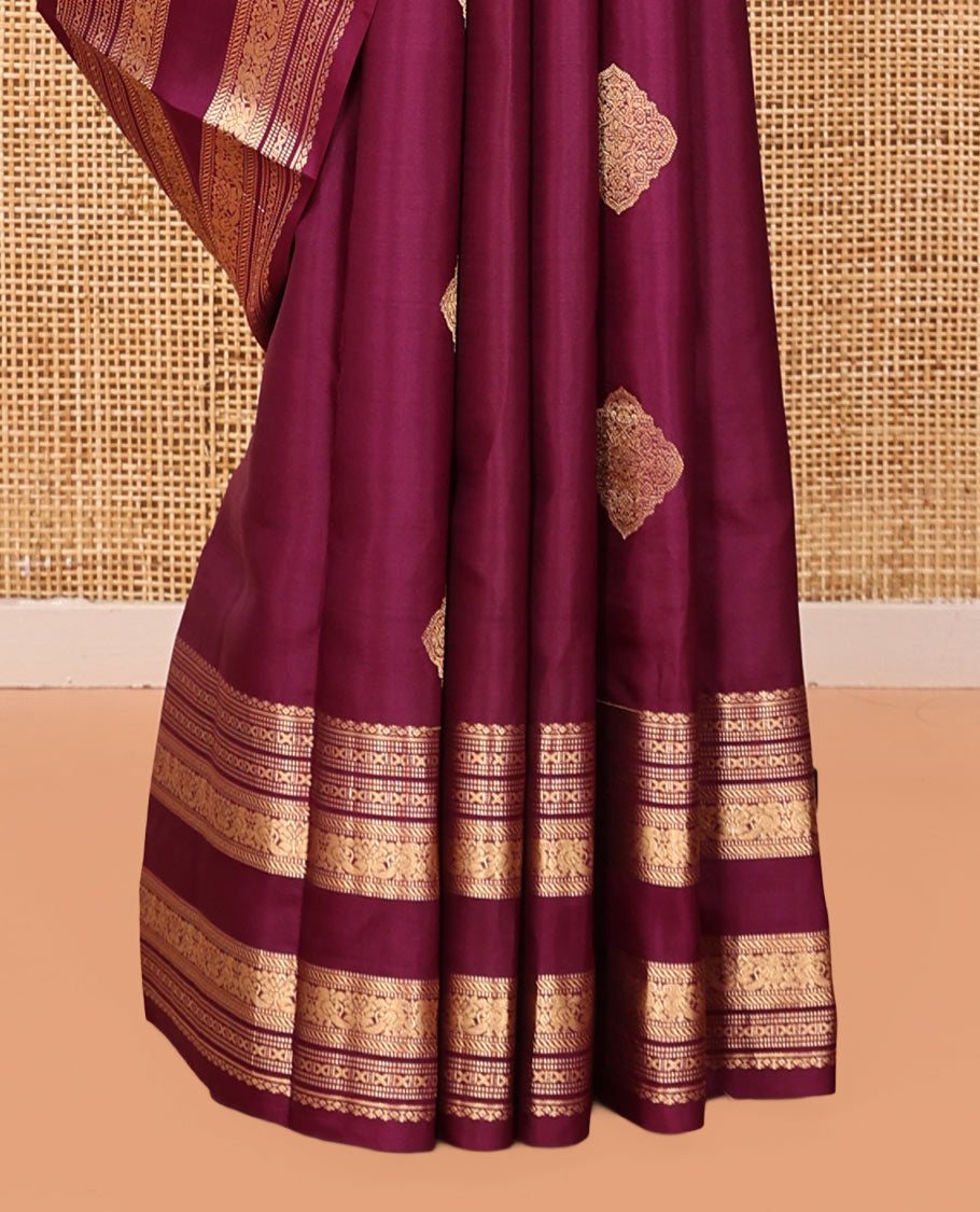 Wine Vasundhara Silk Saree, Woven with Zari Buttas, Highlighted by a Traditional Zari Design Woven Border, Intricate Pallu, and a Matching Blouse