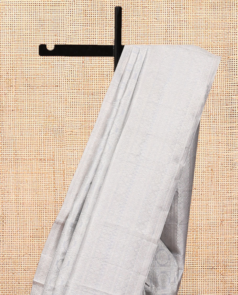 Grey Kanchipuram Wedding Silk Saree Features Chakram Jacquard Design, a Sparsely Woven Zari Border, Ogee Pallu, and a Matching Blouse