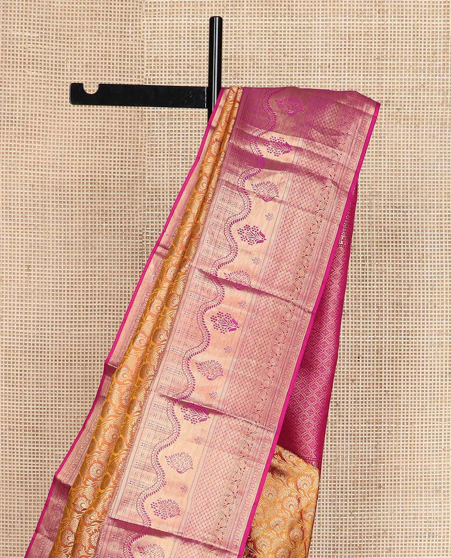 Orange jacquard Kanchipuram wedding silk saree, contrast traditional zari design border, and zari-rich jaal pallu