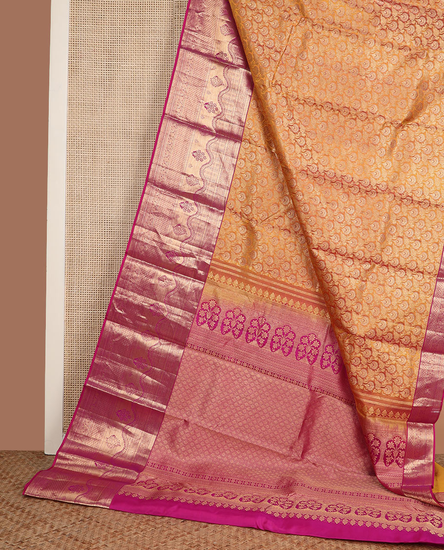 Orange jacquard Kanchipuram wedding silk saree, contrast traditional zari design border, and zari-rich jaal pallu