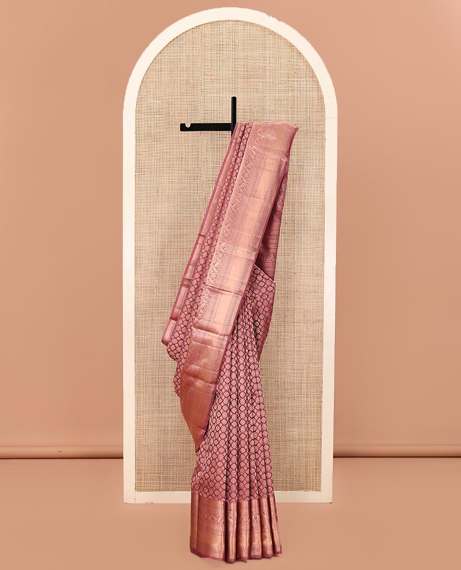 Rosewood Pink Kanchipuram Wedding Silk Saree, Artfully Detailed with Jacquard on Its Body, Highlighted by a Zari Border of Thilakam, Kamalam, Round Mayil, and Yaanai Designs, Opulently Embellished Pallu, and Paired with a Matching Blouse