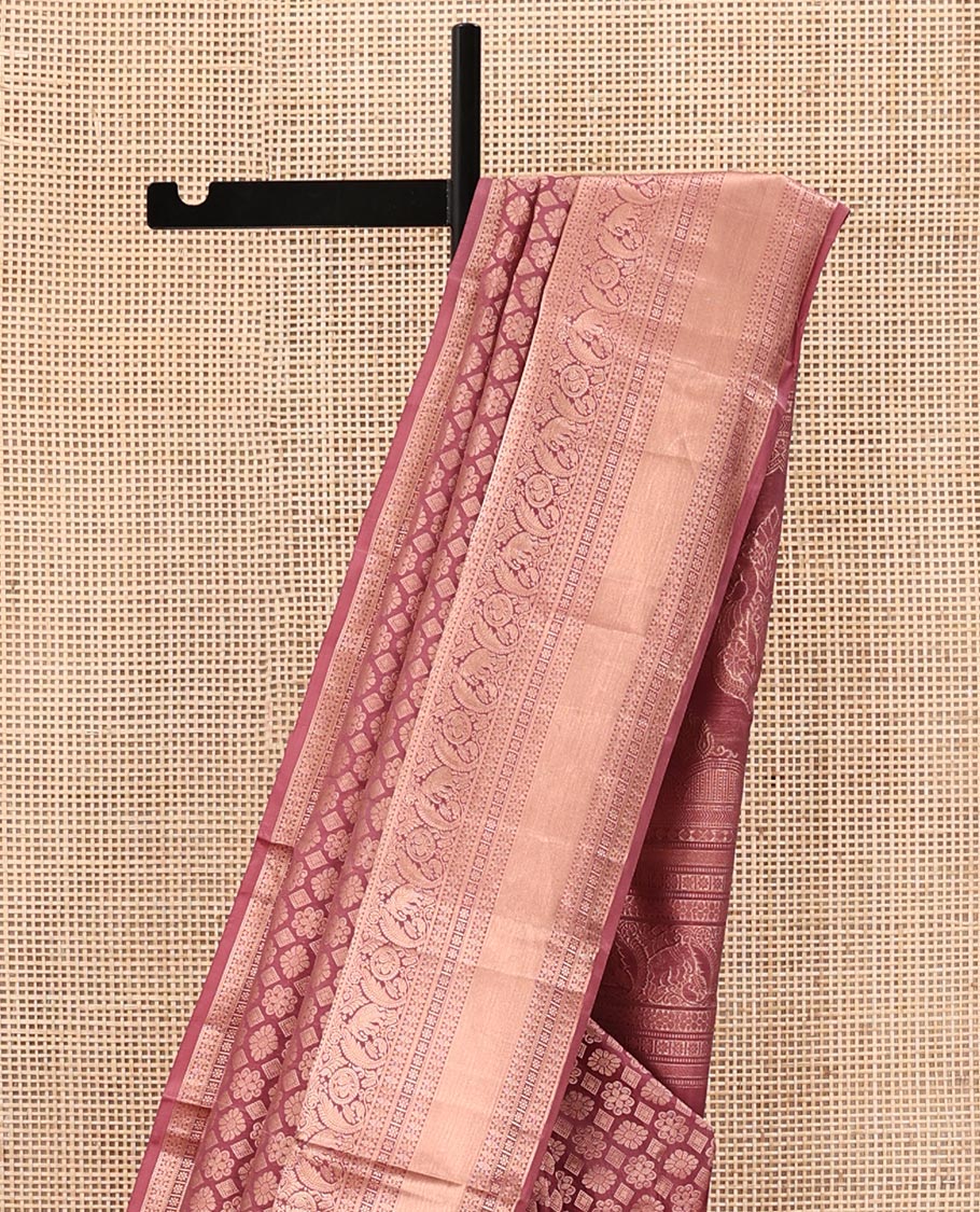 Rosewood Pink Kanchipuram Wedding Silk Saree, Artfully Detailed with Jacquard on Its Body, Highlighted by a Zari Border of Thilakam, Kamalam, Round Mayil, and Yaanai Designs, Opulently Embellished Pallu, and Paired with a Matching Blouse