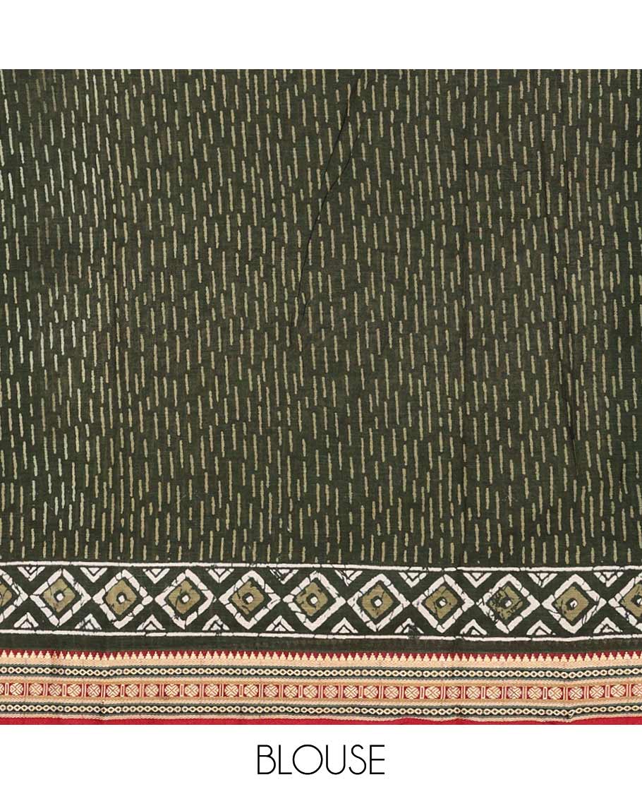 Green batik style argyle printed mul mul cotton saree, contrast traditional motifs border, and pallu of geometric and paisley print