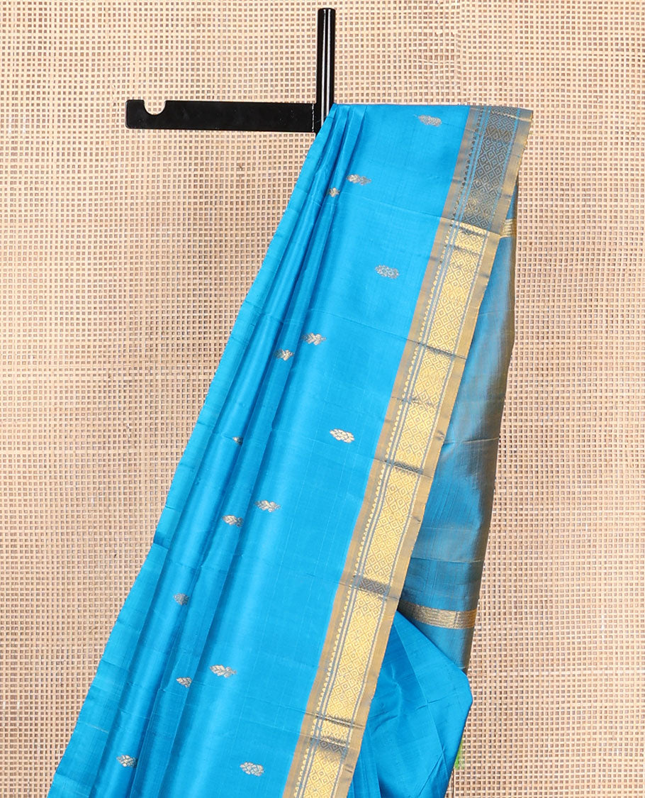 Blue kanchipuram silksaree with zari buttas, contrast one-sided border of rekku & mayil kann & zari design pallu