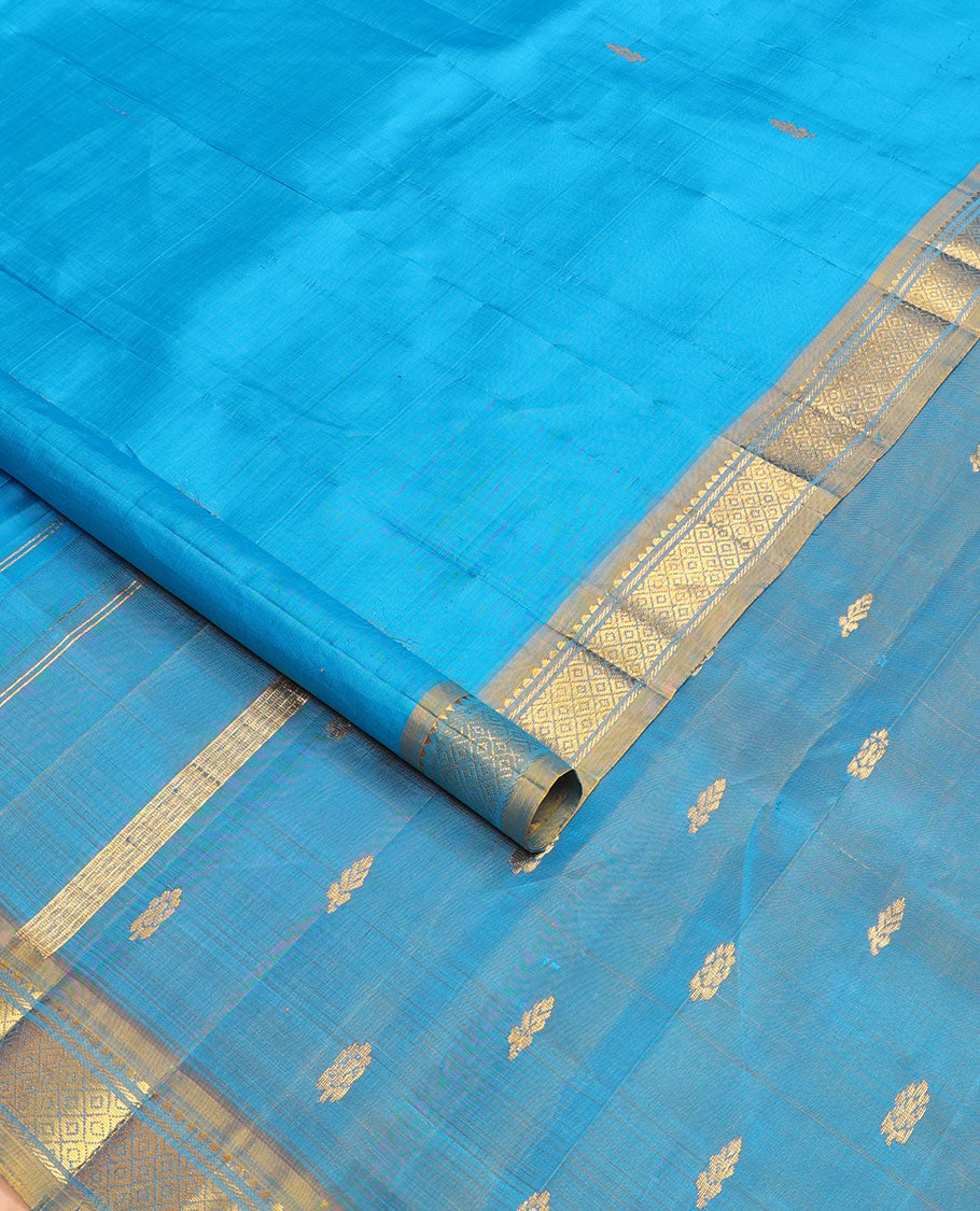 Blue kanchipuram silksaree with zari buttas, contrast one-sided border of rekku & mayil kann & zari design pallu
