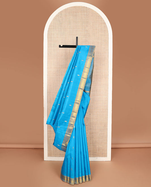 Blue kanchipuram silksaree with zari buttas, contrast one-sided border of rekku & mayil kann & zari design pallu