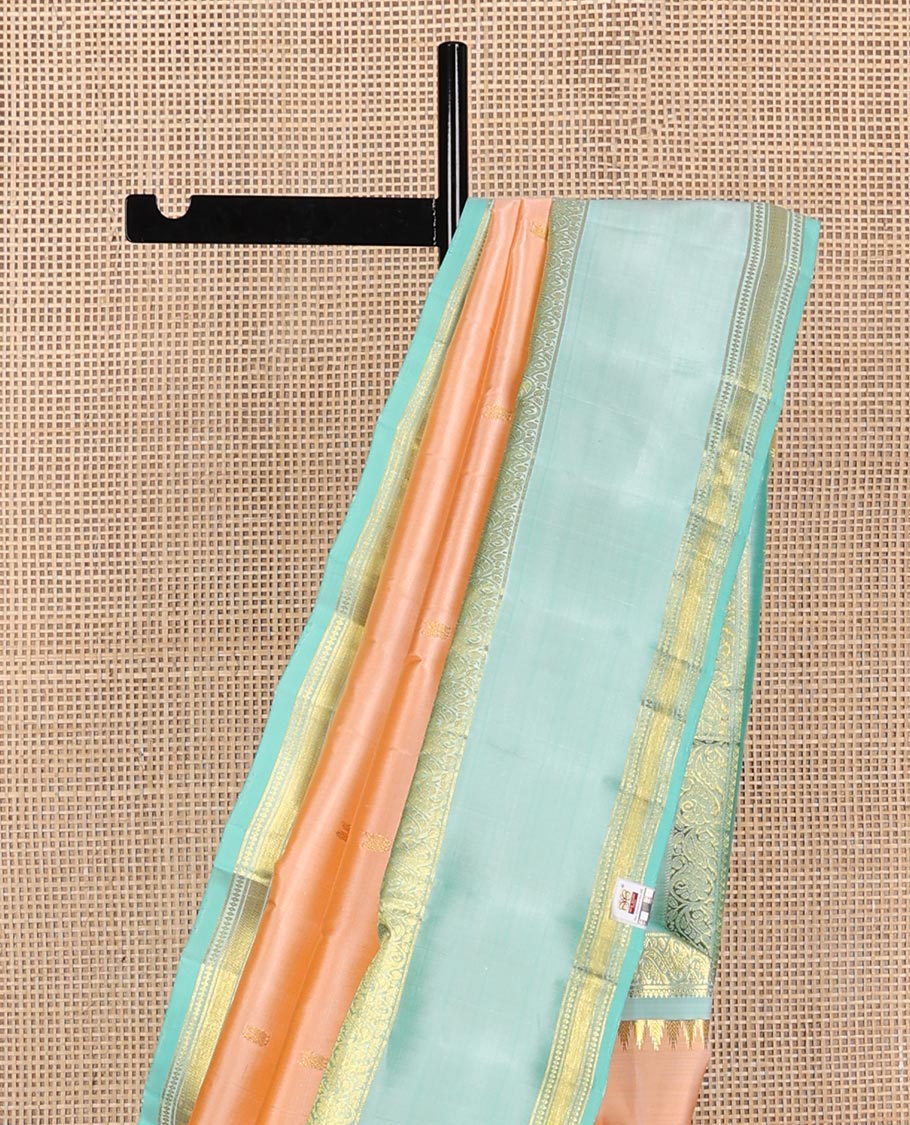 Light orange zari buttas Kanchipuram silk saree, contrast thazampoo rekku border of thilakam mokku,banaras,diamond, and kodi visiry designs and jaal pallu